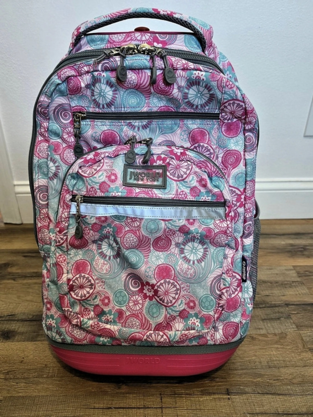 J World New York Sunrise Rolling Backpack Floral Pink & Blue